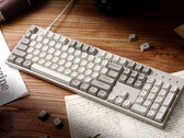 Keychron C2 Pro 8K on a desk surrounded by papers and books