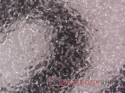 Matte E-Ink surface magnified. Since the display does not emit light on its own, content is viewable under direct sunlight