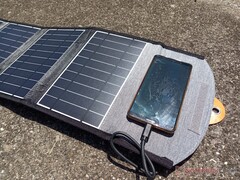 We tried charging our smartphone with a 22 W foldable solar power charger. It took days