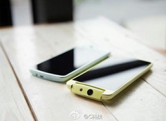 Oppo N1 mini smartphone with rotating camera and gold frame
