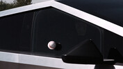 Tesla used a baseball to recreate the test that saw Franz von Holzhausen smash the Cybertruck's window at the original unveiling. (Image source: Tesla)