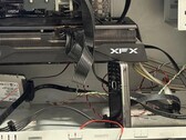 A Reddit user is propping up the graphics card in his PC with an old Nokia 6124 Classic. (Image source: u/bulochklem via Reddit)