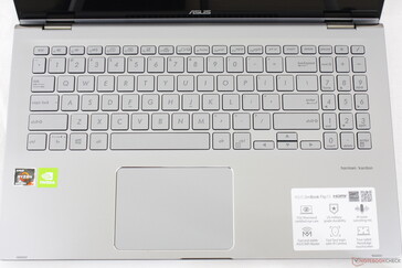 Standard keyboard layout but with the power button relocated to the left edge of the chassis
