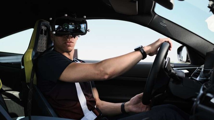 Drivers wear low latency Varjo virtual reality headsets while driving in real life. (Source: BMW)
