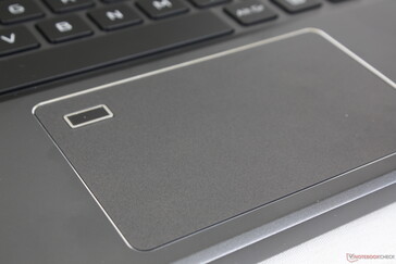 Smooth touchpad with chrome perimeter and corner fingerprint reader
