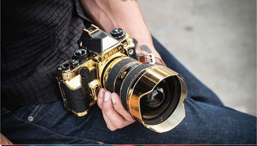 Gold and leather-adorned Nikon kit. (Source: Brikk)