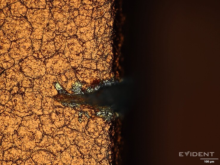 Image showing just what those scratches look like under a digital microscope (Image Source: iFixit)
