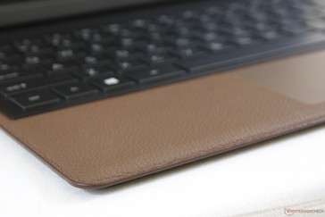Leather palm rests are more resistant to fingerprints than the typical glossy metal surface