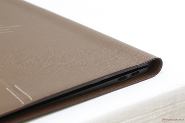 Leather casing extends beyond the edges of the metal chassis and adds to the footprint