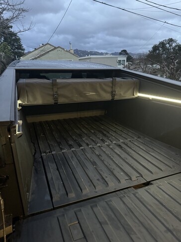 The Cybertruck's Basecamp tent packs away somewhat neatly under the tonneau cover when not in use. (Image source: Cybertruck Owners' Club)