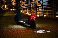 Bugatti&#039;s electric scooter features an LED light which projects the brand&#039;s logo on the ground when riding it (Image: Bugatti)