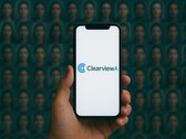 Smartphone with Clearview AI on it, face database in the background (Image source: AI-generated)