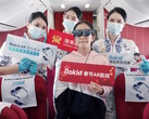 Hainan Airlines passengers enjoy virtual entertainment while wearing Rokid Max AR glasses during Lunar New Year flights. (Source: Rokid)