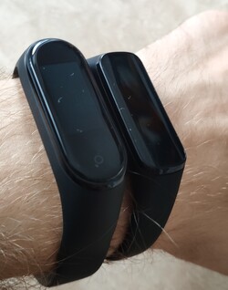 Xiaomi Mi Band 4 (left) and Samsung Galaxy Fit e (right) on a wrist