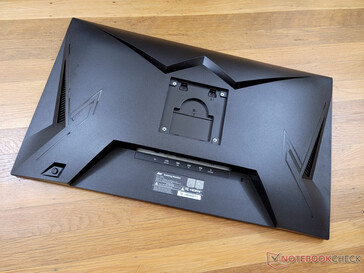 Curved backside is mostly plastic. The monitor is VESA compatible