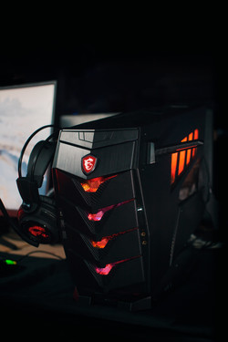MSI Aegis 3 8RD with its headset holders and RGB lighting switched on (Source: MSI)