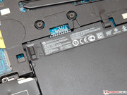 The 50 Wh battery can be removed easily. It is not glued or fastened with screws.