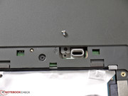You have to loosen one screw underneath the large maintenance cover before you can remove the optical drive.