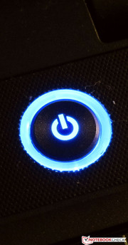 The blue light of the power button provides a colorful accent.