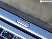 This button mechanically releases the "lid's" lock.