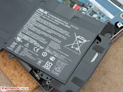 The 48 Wh battery is affixed to the case in several places.
