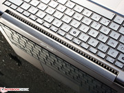 The cooling airflow is sucked in over the keyboard and blown out under the hinge.