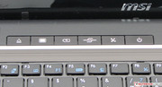 A few hot keys are found above the keyboard. Their functions from left to right: DVD eject, screen power, power settings, Mobility Center, Wi-Fi, power