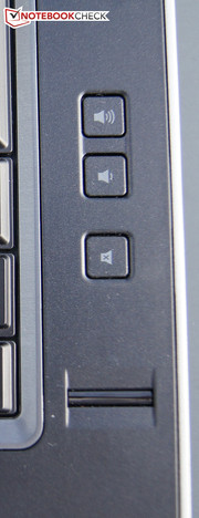 A fingerprint scanner is on the keyboard's right and volume control is beside the speakers.