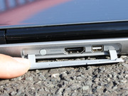 HDMI and a mini DisplayPort are underneath the rubber cover (rear).