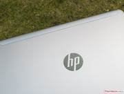 The striking HP logo on the back is implemented in piano paint.