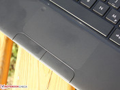 Touchpad: the same level as the palm rest, small nubs prevent finger grease.