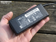 The 90 Watt AC adapter is relatively heavy with 350 grams.