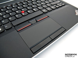 The touchpad is surrounded by four mouse keys