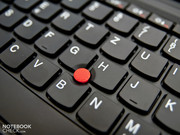 Lenovo's mandatory TrackPoint gleams in bright red and is between the keys.