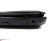 The power socket is located pretty far in the back, but a very protruding power cable is connected to it. The power socket is located pretty far in the back, but a very protruding power cable is connected to it.