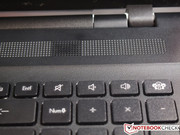 The notebook features stereo speakers.