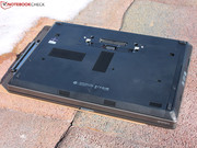 The underside of the laptop is dominated by a large maintenance hatch,