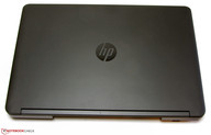 HP uses a rubberized display cover.
