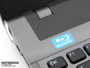 The stereo loudspeakers are located above the keyboard under this perforated metal plate. The stereo loudspeakers are located above the keyboard under this perforated metal plate.