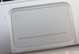 A on/off switch is located at the top left corner of the touchpad; an LED indicates activity.