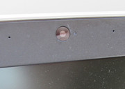 The webcam is surrounded by two microphones.