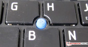 A pointing device is found in the keyboard's center.