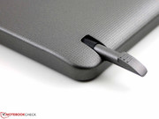 A small digitizer pen is inserted into the tablet.