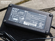 The thick power supply weighs 668 grams.  The powerful laptop consumes up to 120W under extreme use.