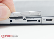 The Micro-SD card slot is hidden under a flap. Unfortunately there's no SIM card option in the US.