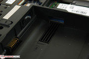 Full-size SIM slot underneath battery compartment