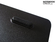There is a foot on the battery. There is a foot on the battery.