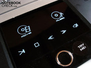 The middle button on the touchpad activates the 'Media Console' The middle button on the touchpad activates the 'Media Console'