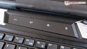 A touch sensitive bar is located above the keyboard.