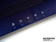 Numerous status LEDs are found below the touchpad.